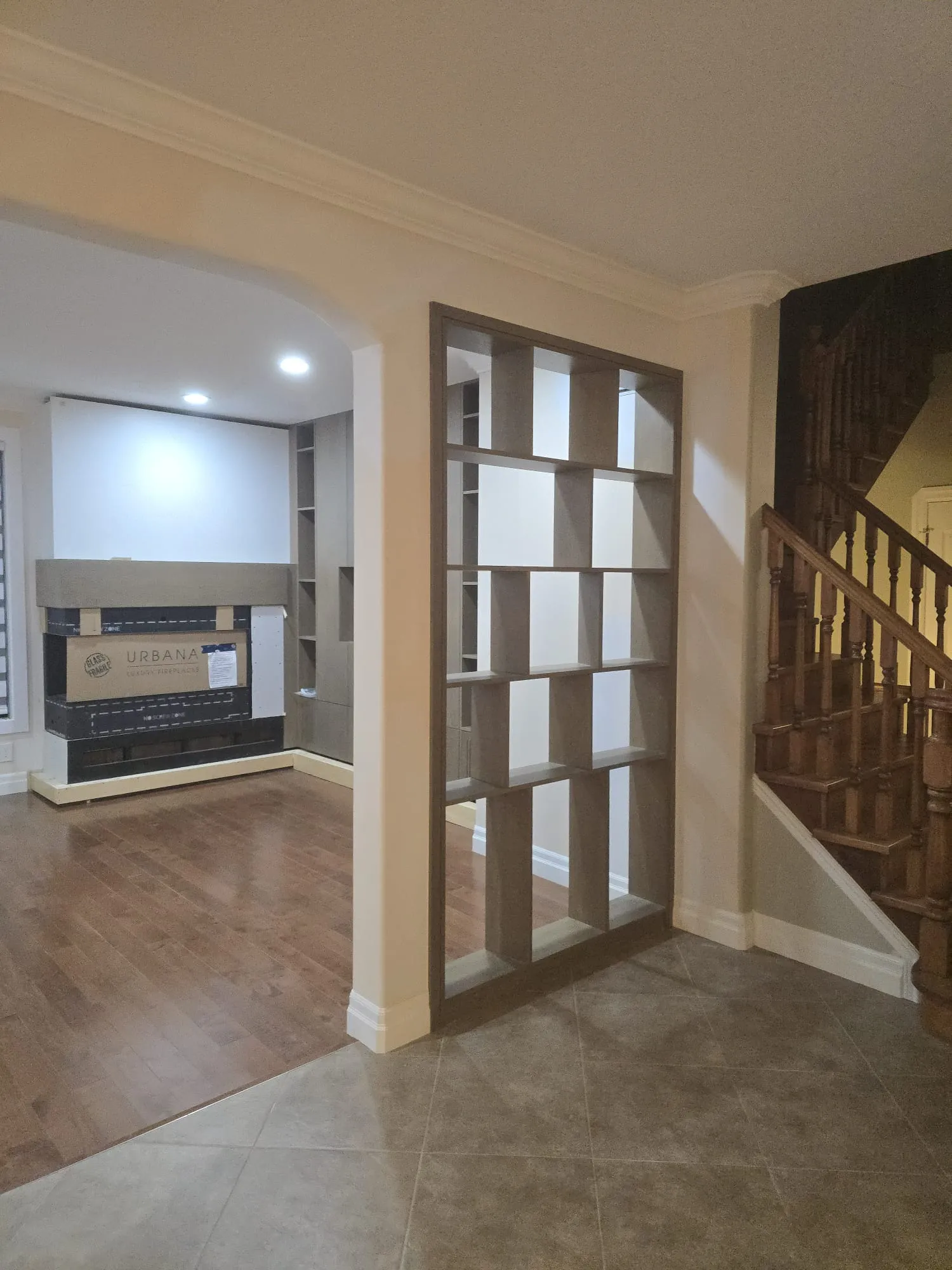 Custom open wood shelving used as an architectural room divider