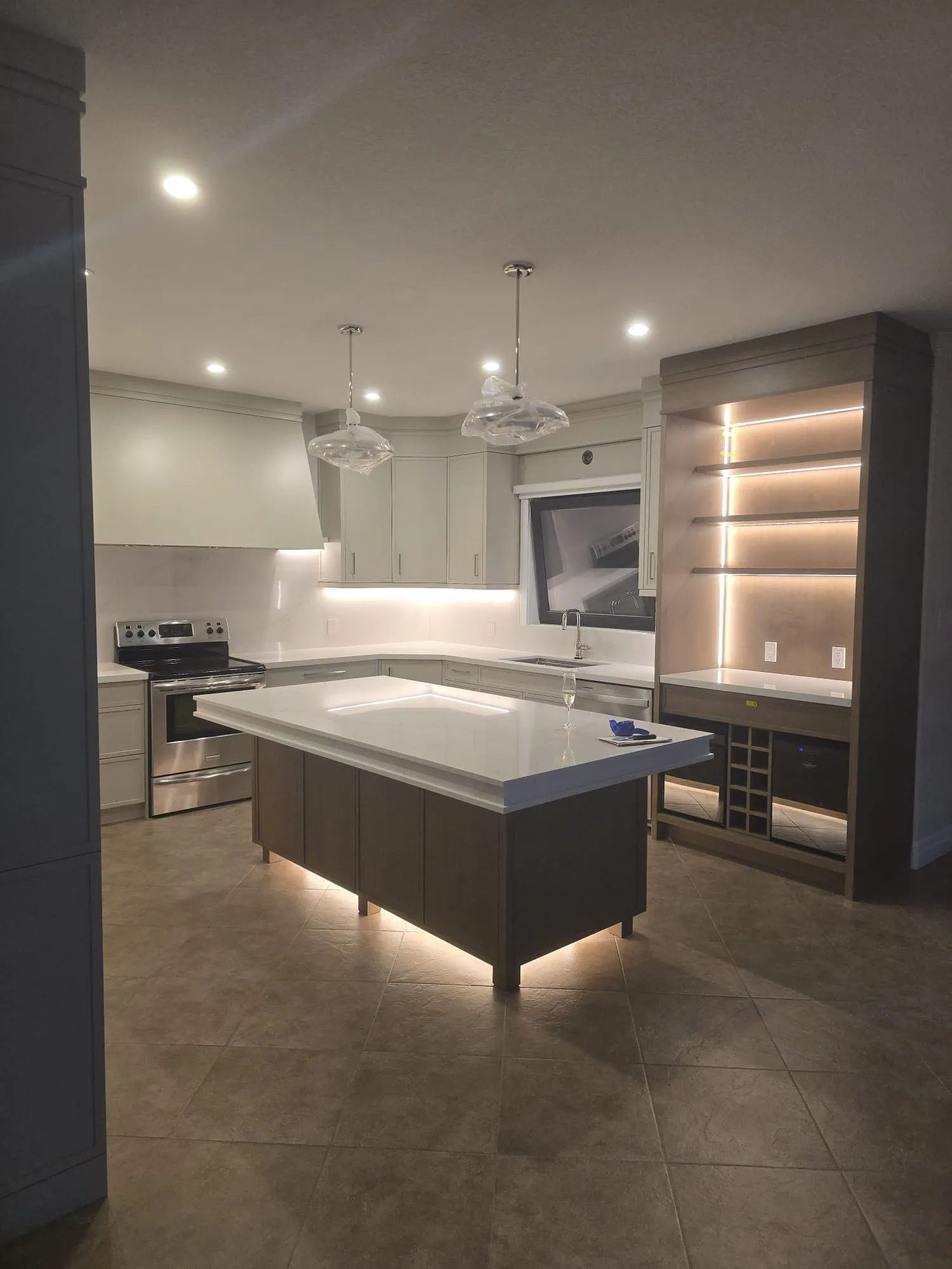 Custom kitchen island with under-cabinet illumination